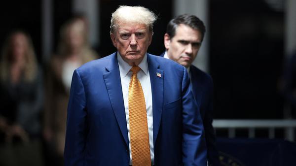 Former U.S. President Donald Trump walks amid his trial for allegedly covering up hush money payments, at Manhattan Criminal Court on May 7, 2024, in New York City, U.S. Trump has been charged with 34 counts of falsifying business records, which prosecutors say was an effort to hide a potential sex scandal, both before and after the 2016 presidential election. Trump is the first former U.S. president to face trial on criminal charges.     Win McNamee/Pool via REUTERS