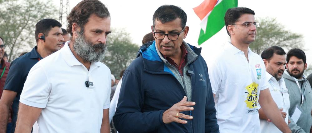 Rahul Gandhi, leader of India's main opposition Congress party, and former India central bank chief Raghuram Rajan attend Bharat Jodo Yatra, or Connect India March, in the northwestern state of Rajasthan, India, December 14, 2022. All India Congress Committee/Handout via REUTERS THIS IMAGE HAS BEEN SUPPLIED BY A THIRD PARTY. NO RESALES. NO ARCHIVES. EDITORIAL PURPOSES ONLY.