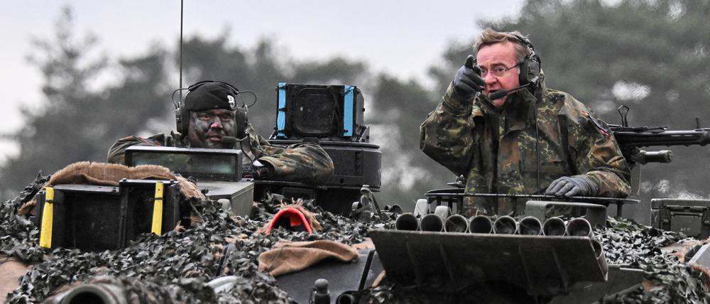 German Defense minister Boris Pistorius rides a tank as he visits Leopard II tanks that are due to be supplied to Ukraine at the tank brigade Lipperland of Germany's army and part of the Bundeswehr, in Augustdorf, Germany, February 1, 2023. REUTERS/Benjamin Westhoff
