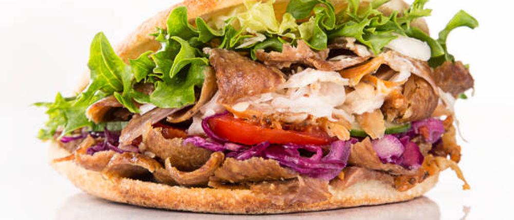 close up of kebab sandwich on white background