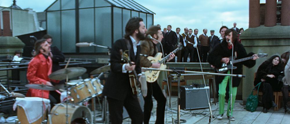 Die Beatles bei ihrem Guerilla-Konzert über den Dächern von London im Januar 1969. Ihr letzter Auftritt.