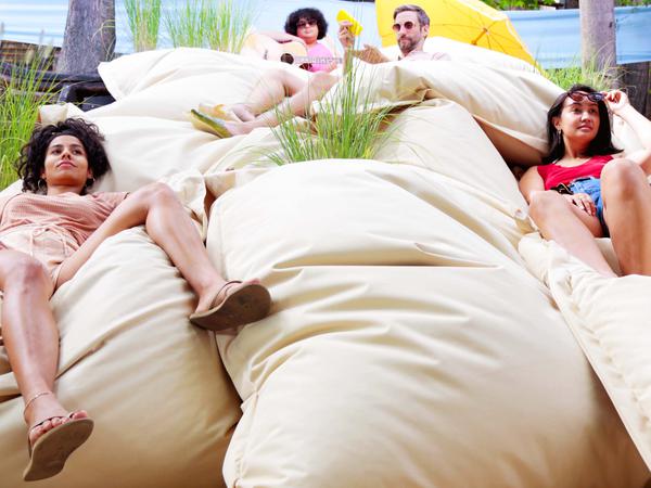 Comfortable on the go: young men wear beanbags