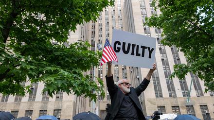 NEW YORK, NEW YORK - MAY 30: People celebrate after former President Donald Trump was found guilty on all counts at Manhattan Criminal Court on May 30, 2024 in New York City. The former president was found guilty on all 34 felony counts of falsifying business records in the first of his criminal cases to go to trial.   Spencer Platt/Getty Images/AFP (Photo by SPENCER PLATT / GETTY IMAGES NORTH AMERICA / Getty Images via AFP)