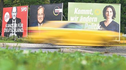 Wahlplakate mit den Spitzenkandidaten Olaf Scholz (SPD.), Armin Laschet (CDU) und Annalena Baerbock (Bündnis 90/Die Grünen).