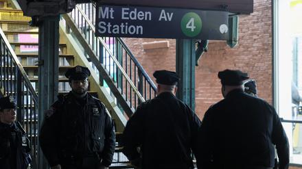 Members of the New York Police Department (NYPD) investigate the scene