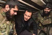 Syriens Präsident Baschar al-Assad im Gespräch mit Soldaten.