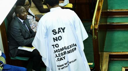 Member of Parliament from Bubulo contituency John Musira dressed in an anti gay gown attends the debate of the Anti-Homosexuality bill inside the chambers, which proposes tough new penalties for same-sex relations during a sitting at the Parliament buildings in Kampala, Uganda March 21, 2023. REUTERS/Abubaker Lubowa