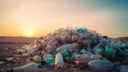 waste plastic bottles and other types of plastic waste at a waste disposal site.Generative AI