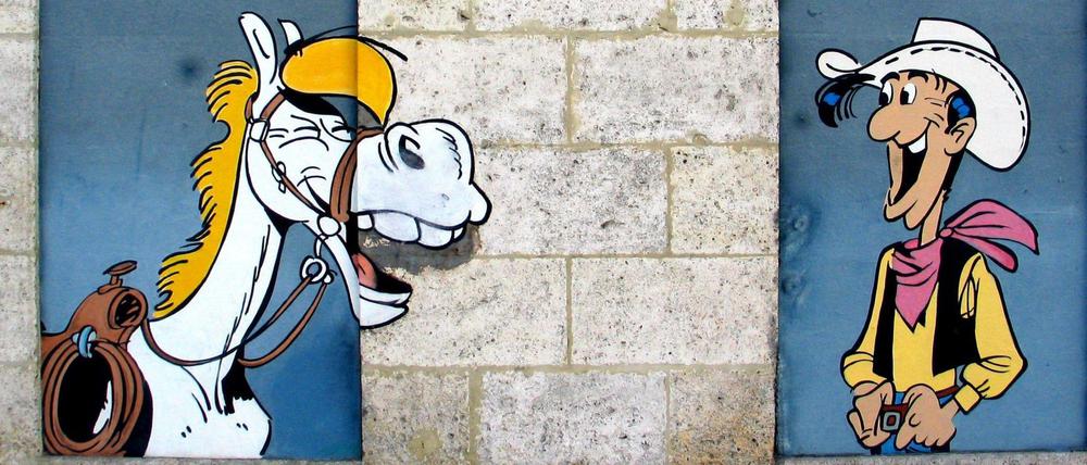Erfolgsteam. Seit mehr als 70 Jahren reiten Lucky Luke und Jolly Jumper - hier ein Wandbild in Angouleme - durch den Wilden Westen.