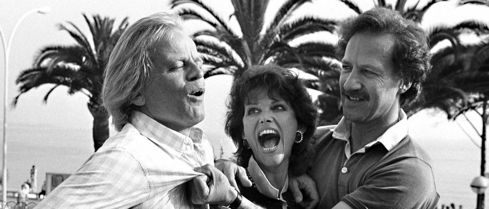 Trio infernale. Klaus Kinski, Claudia Cardinale und Werner Herzog (v.l.) bei der Prästehen ihres Wettbewerbsbeitrags "Fitzcarraldo" bei den Filmfestspielen von Cannes im Mai 1982.