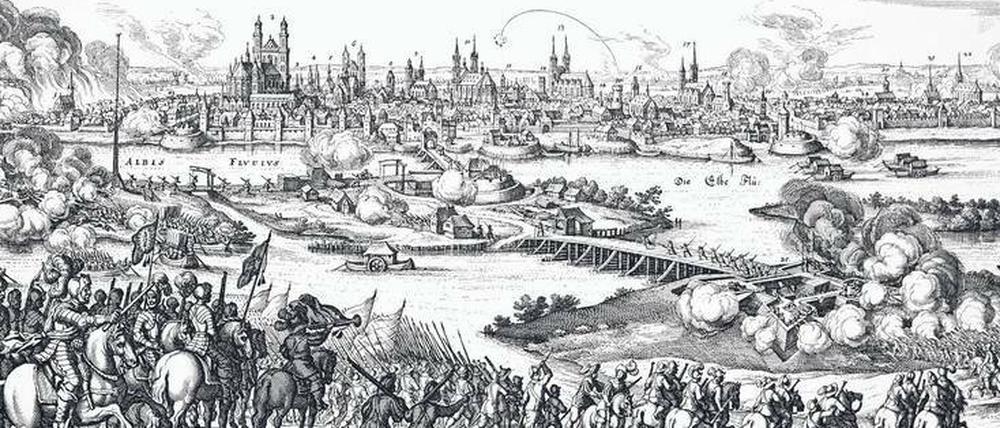 Magdeburg vor dem Fall. Im Mai 1631 wurde die Stadt von den kaiserlichen Heeren belagert und schließlich zerstört. Das grausige Geschehen zeigt dieser Kupferstich von Matthäus Merian d. Ä.
