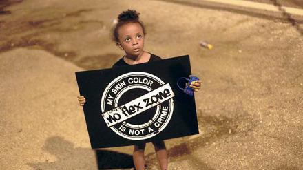 Die Lage verbessern. Auch dieses kleine Mädchen protestiert in Ferguson gegen die Erschießung von Michael Brown. 