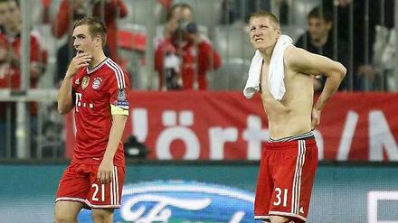 Sehen so Weltmeister aus? Die sichtlich geknickten Nationalspieler Bastian Schweinsteiger und Philipp Lahm nach dem Champions-League-Aus gegen Real Madrid.