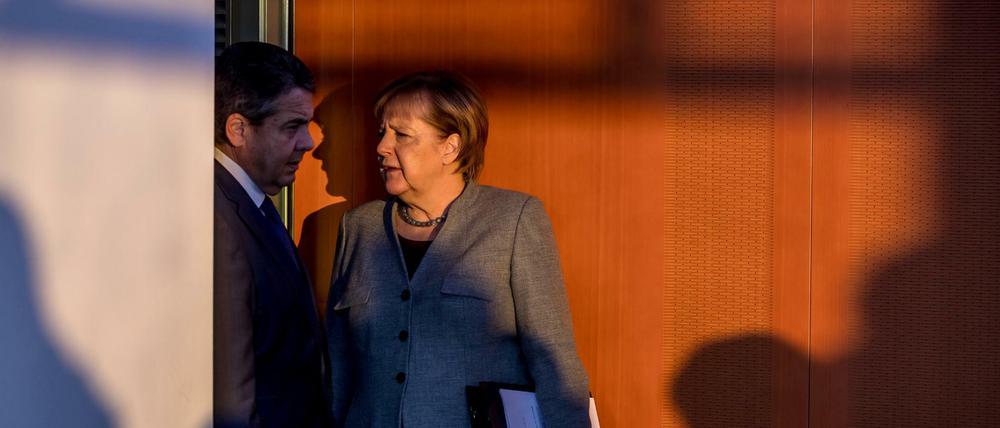 Wer steht im Licht, wer im Schatten? Angela Merkel oder Siegmar Gabriel?
