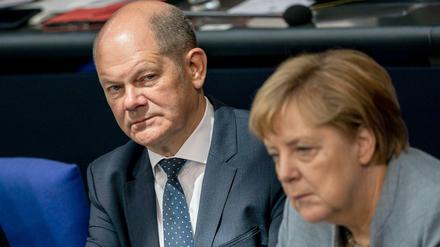 Was tun mit den Milliarden? Finanzminister Olaf Scholz (SPD) und Bundeskanzlerin Angela Merkel (CDU)
