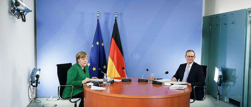 Angela Merkel (CDU) und Michael Müller (SPD).