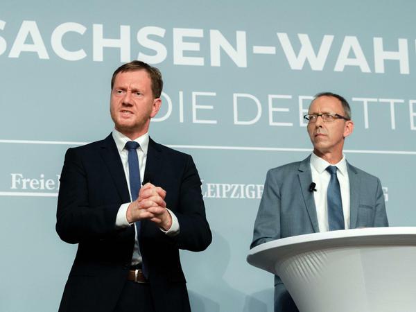 Spitzenkandidaten Michael Kretschmer (CDU, links) und Jörg Urban (AfD) bei einer Podiumsdiskussion zur Sachsen-Wahl am Mittwochabend in Dresden. 