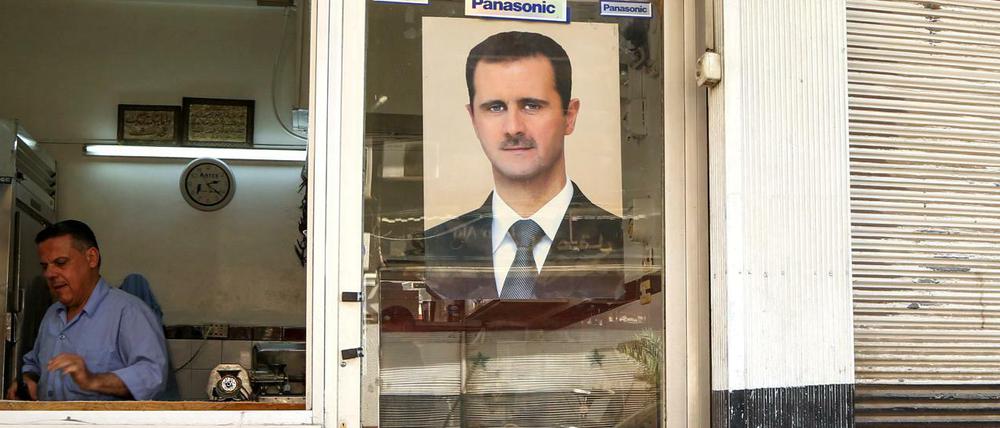 Ein Foto von Syriens Präsident Assad. 