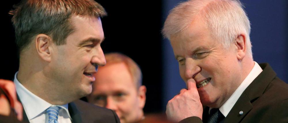 FILE PHOTO: Bavarian Prime Minister and head of the Christian Social Union (CSU) Horst Seehofer listens to Bavarian Finance Minister Markus Soeder (L) during a CSU party congress in Munich, Germany November 20, 2015. REUTERS/Michaela Rehle/File Photo