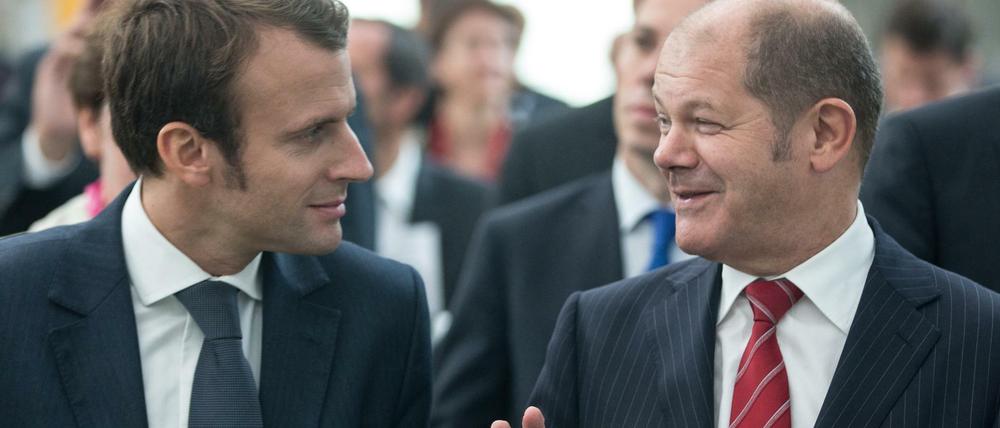 Alte Bekannte. Ex-Wirtschaftsminister Macron (links) und Hamburgs früherer Bürgermeister Scholz bei einer Begegnung 2014.