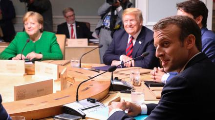 Kanzlerin Merkel, US-Präsident Trump und Frankreichs Präsident Macron (v.l.n.r.) beim G-7-Gipfel in La Malbaie.