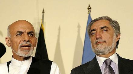 Dia afghanischen Präsidentschaftskandidaten Aschraf Ghani (l.) und Abdullah Abdullah.