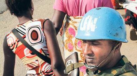 Unter Aufsicht. Blauhelme versuchen Bewohner Abidjans zu schützen. 