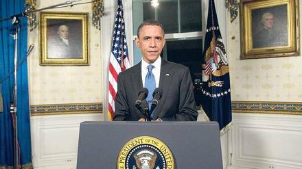 Unter Beobachtung. US-Präsident Barack Obama musste zwischen seinen Demokraten und der Mehrheitsfraktion der Republikaner vermitteln, um mit einem regulären Etat weiterregieren zu können. Foto: AFP