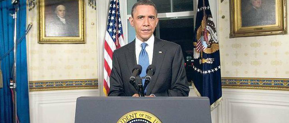 Unter Beobachtung. US-Präsident Barack Obama musste zwischen seinen Demokraten und der Mehrheitsfraktion der Republikaner vermitteln, um mit einem regulären Etat weiterregieren zu können. Foto: AFP
