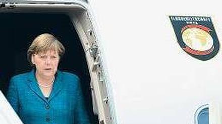 Geschafft. Merkel in Indien. Foto: dpa