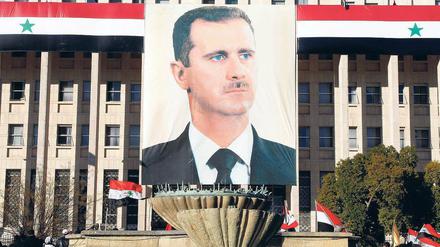 Vor der Zentralbank in Damaskus ist Baschar al Assad noch Herr des Geschehens.