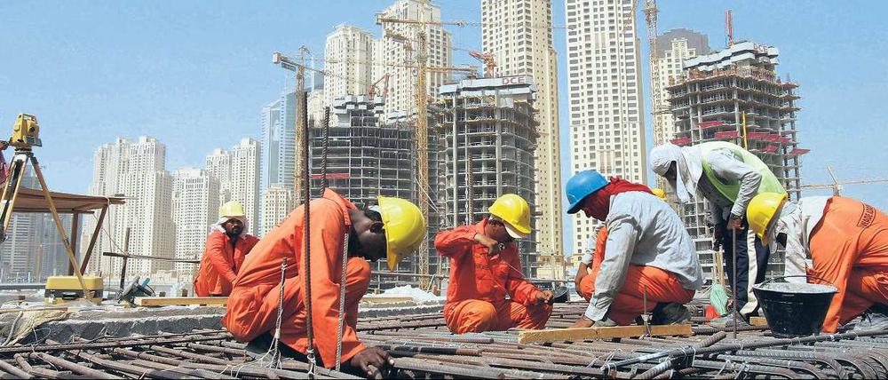 Asiatische Bauarbeiter in Dubai.