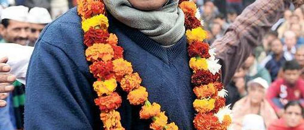 Einer für alle. Arvind Kejriwal und seine Partei sind beliebt bei den kleinen Leuten. Dass sie es überhaupt an die Macht schafften, gilt als Überraschung. Foto: Sajjad Hussain/AFP