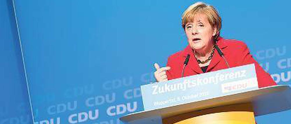 Gemischte Aussichten: Bundeskanzlerin Angela Merkel schwört bei der „Zukunftskonferenz“ ihrer CDU in Wuppertal die Basis auf ihre Flüchtlingspolitik ein. 
