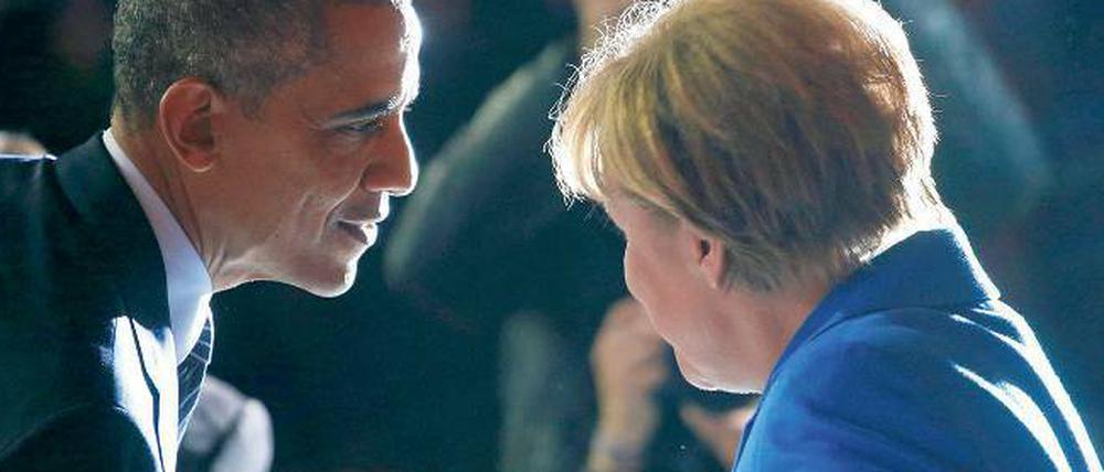 Ziehen an einem Strang. US-Präsident Barack Obama und Bundeskanzlerin Angela Merkel unterhalten sich am Montag auf der UN-Klimakonferenz in Paris. 