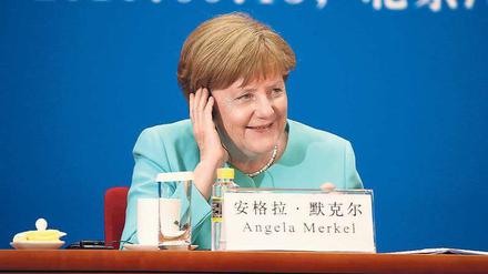 Angela Merkel in China: Wirtschaftliche Interessen und politische Wunschvorstellungen prallen aufeinander.