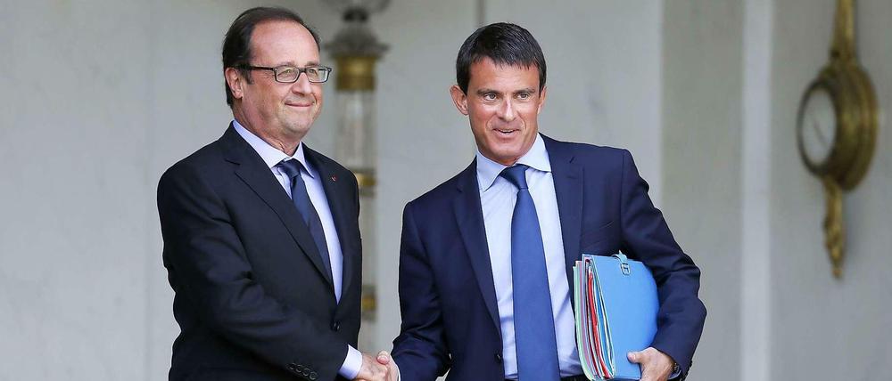 Staatschef Hollande (links) hat Premierminister Valls mit einer Regierungsumbildung beauftragt.