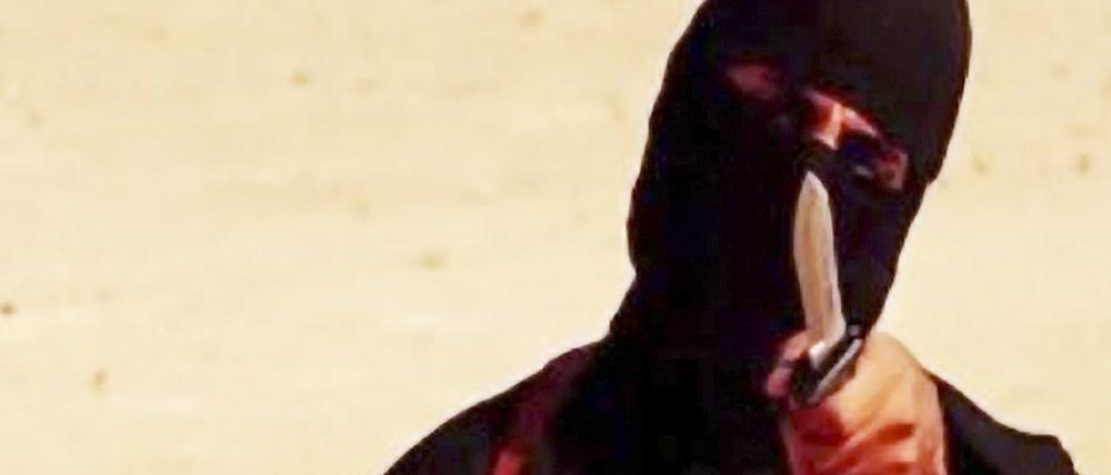 Screenshot einer Szene aus einem Video, das von der Terrormiliz Islamischer Staat (IS) am 02.09.2014 veröffentlicht wurde und einen maskierten Mann mit Messer bei der Hinrichtung des US-Journalisten Sotloff zeigen soll. Bei der Person soll es sich nach Medienberichten um Mohammed Emwasi handeln. 