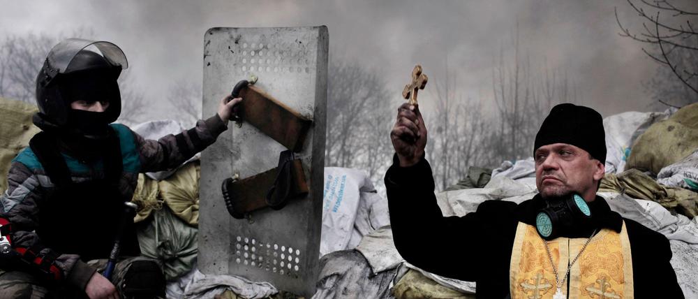 Eine preisgekrönte Fotomontage von Jerome Sessini zeigt die Lage in der Ostukraine. Die Montage stammt aus 2014. Doch gekämpft wird immer noch.