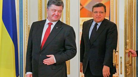 Türen öffnen sich, sie können aber auch zugeschlagen werden. Die Ukraine und Präsident Poroschenko suchen Annäherung an die EU mit Kommissionspräsident Jose Manuel Barroso.