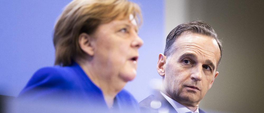 Angela Merkel und Heiko Maas sprechen auf der Pressekonferenz nach dem Libyen-Gipfel in Berlin.