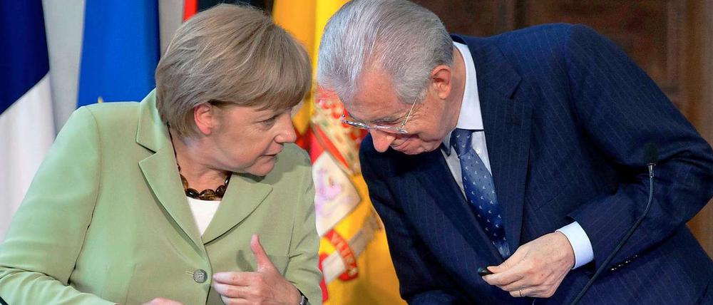 Angela Merkel und Mario Monti haben sich am Freitag mit den Regierungschefs Frankreichs und Spaniens getroffen, um über Lösungsansätze der Schuldenkrise zu sprechen.