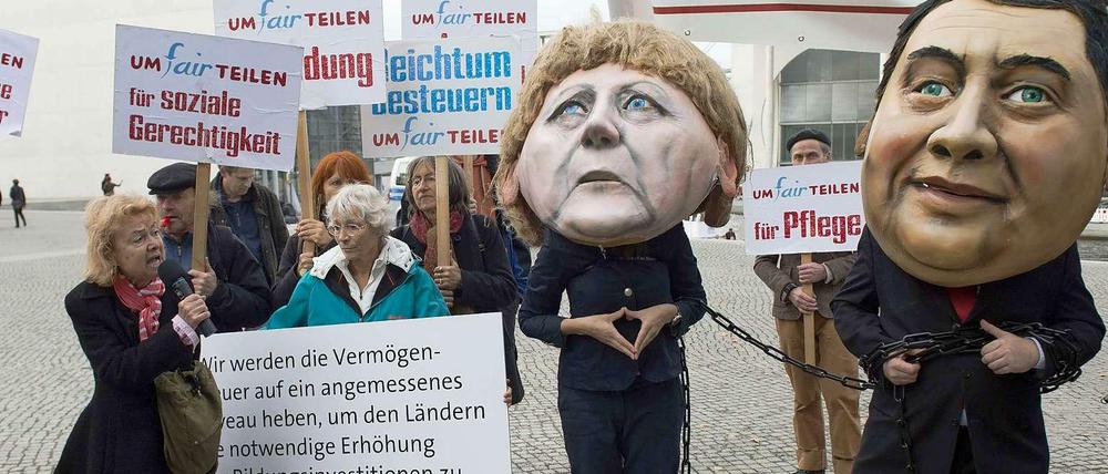 Aneinandergekettet? Am Donnerstag gehen Angela Merkel und Sigmar Gabriel weiter aufeinander zu. 