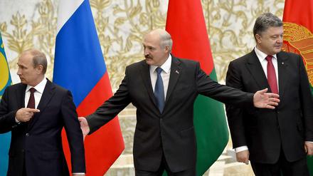 Putin, Lukaschenko und Poroschenko (von links) am Dienstag in Minsk