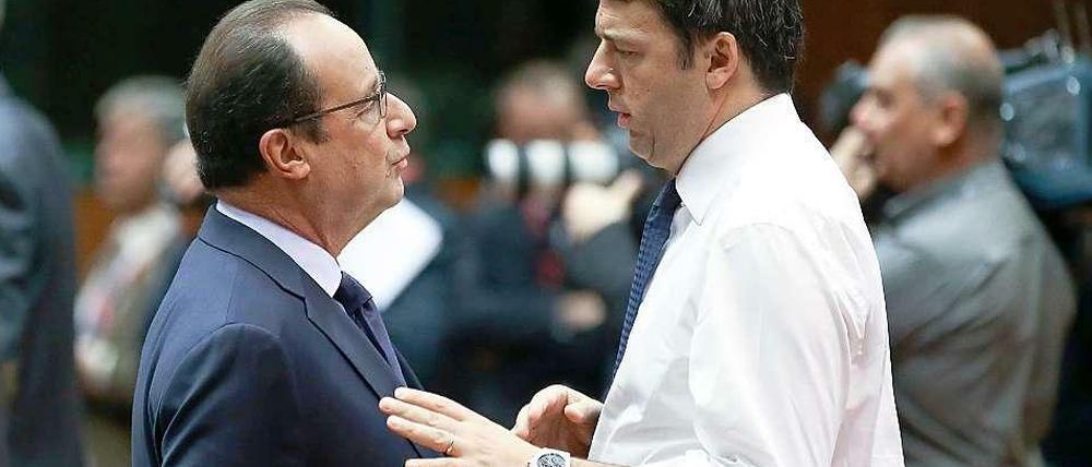 Der haushaltspolitische Kurs von Frankreichs Staatschef Hollande (links) und Italiens Regierungschef Renzi stößt bei der OECD auf Nachsicht.