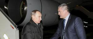 Wladimir Putin und Sergei Aksjonow.