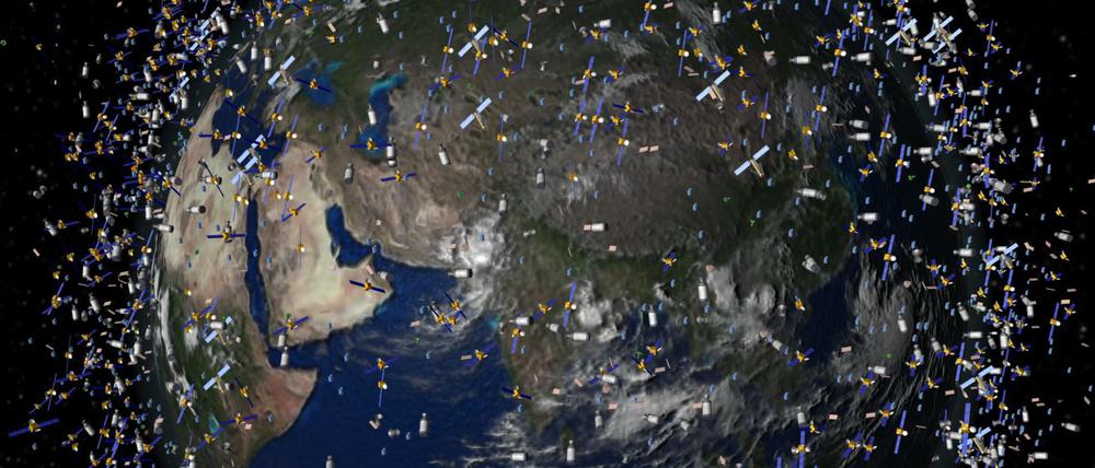 Bald wie bei Hempels unterm Sofa. Computergeneriertes Bild der European Space Agency (ESA) mit Weltraummüll früherer Weltraummissionen, der neben intakten Satelliten um die Erde kreist.