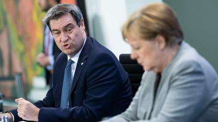 CSU-Chef Söder und Kanzlerin Merkel informieren zur Corona-Krise. 