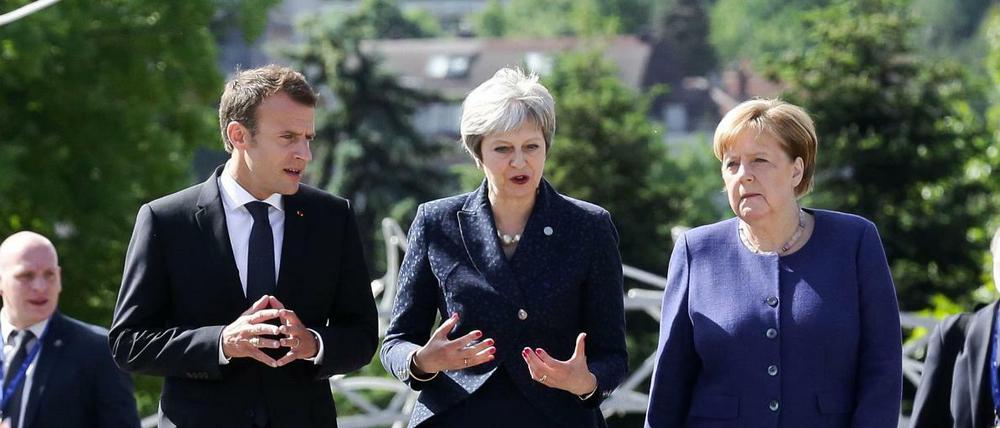Der französische Präsident Emmanuel Macron, Kanzlerin Angela Merkel und die britische Premierministerin Theresa May (Mitte) auf dem Westbalkangipfel im Mai in Sofia.
