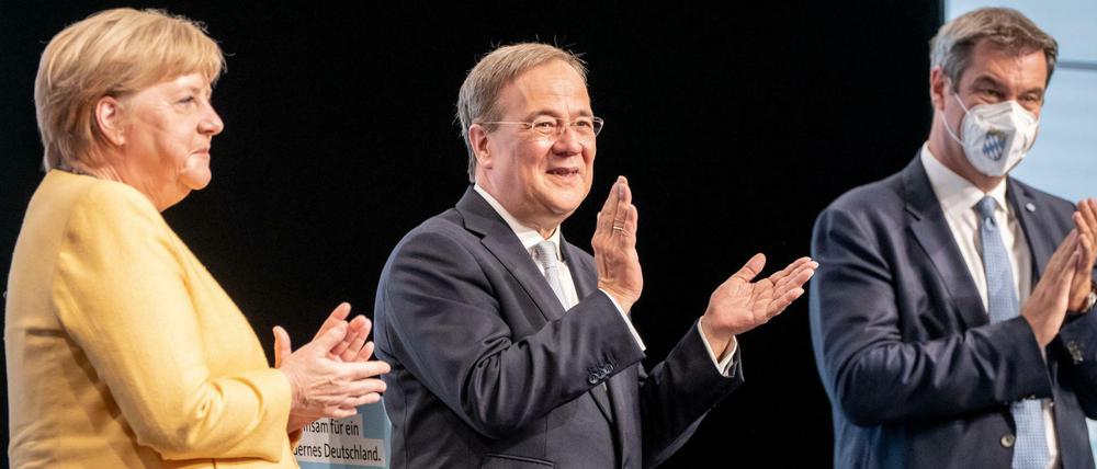 Kanzlerin Angela Merkel (CDU), Kanzlerkandidat Armin Laschet (CDU), verhinderter Kandidat Markus Söder (CSU)